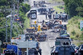 Police Forces Removing Blockage On Rue Iekawe In Noumea