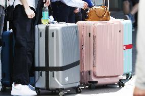 Tourists with suitcases