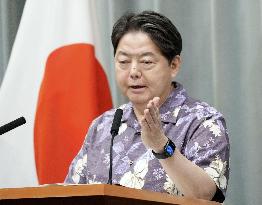 Japan top spokesman in Okinawa shirt