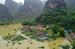 Flood Waters Surround Shilong Village in Hechi