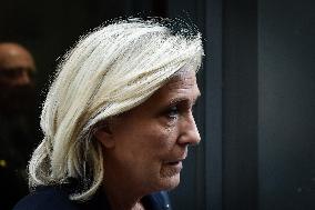 Marine Le Pen exits after a meeting with Marion Marechal and Jordan Bardella at the Rassemblement National headquarters in Paris