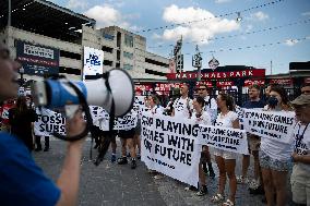 Climate Change Activists Are Protesting Outside The National Park During The Annual Congressional Baseball Game In Washington DC