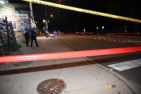 Unidentified Male Wounded After Being Shot While Standing On The Street In Chicago Illinois
