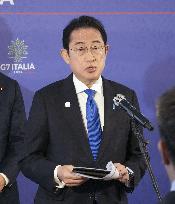 Japan PM meets press in Italy