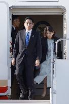 Japan PM returns home