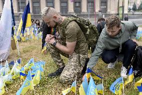 LGBT activists pay tribute to late defenders of Ukraine in Kyiv