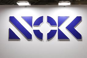 NOK CORPORATION signs and logo