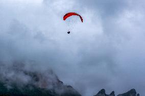 Tourists Ride Paragliders Over The World Natural Heritage site of Jinfo Mountain in Chongqing