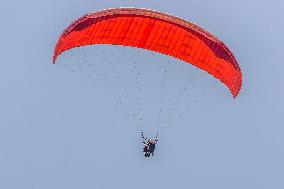 Tourists Ride Paragliders Over The World Natural Heritage site of Jinfo Mountain in Chongqing