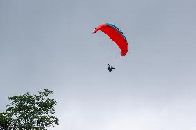 Tourists Ride Paragliders Over The World Natural Heritage site of Jinfo Mountain in Chongqing