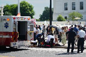 Elderly Man Faints In The Heat Wave At The Supreme Court In Washington DC