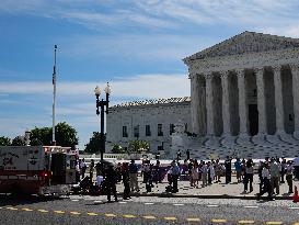 Elderly Man Faints In The Heat Wave At The Supreme Court In Washington DC