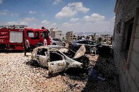 Cars burned during clashes with Israeli forces in West Bank
