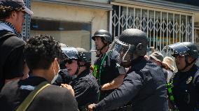 Pro Palestine And Pro Israel Crowds Clash Outside Of Adas Torah During A Sale Of Land In Israel