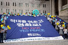 Rally Urges Cessation Of Military Actions And Hostilities Between North And South Korea