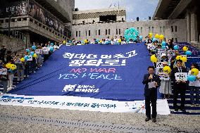 Rally Urges Cessation Of Military Actions And Hostilities Between North And South Korea