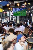 People watch the Fotball Game France - Poland - Paris