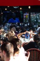 People watch the Fotball Game France - Poland - Paris