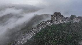 Great Wall Shrouded In Clouds - China