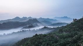Great Wall Shrouded In Clouds - China