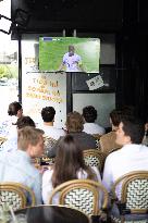 People watch the Football Game France - Belgium - Paris
