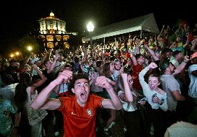 Fans watch the national team game at Jardim do Morro