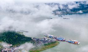 Cloud-shrouded Three Gorges Dam in Yichang