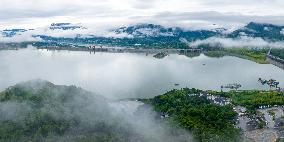 Cloud-shrouded Three Gorges Dam in Yichang