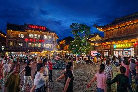 Tourists Enjoy Tea Horse Ancient City in Pu 'er