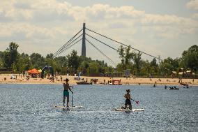 Rescuers Conduct A Drowning Exercise At A Beach On The Banks Of The Dnipro River In Kyiv