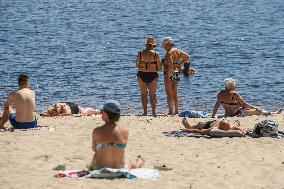 Rescuers Conduct A Drowning Exercise At A Beach On The Banks Of The Dnipro River In Kyiv