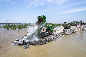 Work Begins Sealing Breach At Freshwater Lake - China