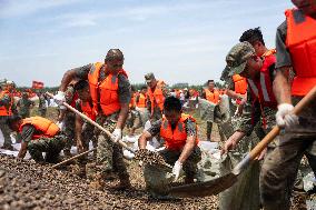 Work Begins Sealing Breach At Freshwater Lake - China