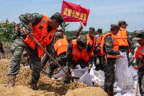 Work Begins Sealing Breach At Freshwater Lake - China