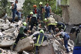 Section of Kyiv apartment block destroyed by Russian missile strike