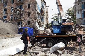 Section of Kyiv apartment block destroyed by Russian missile strike