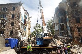 Section of Kyiv apartment block destroyed by Russian missile strike