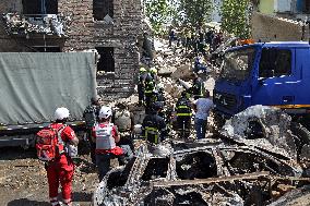 Section of Kyiv apartment block destroyed by Russian missile strike