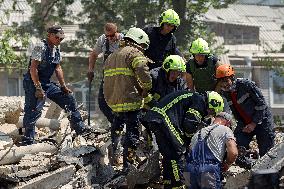 Section of Kyiv apartment block destroyed by Russian missile strike