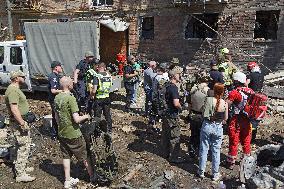 Section of Kyiv apartment block destroyed by Russian missile strike