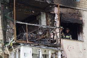 Section of Kyiv apartment block destroyed by Russian missile strike