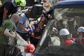 Section of Kyiv apartment block destroyed by Russian missile strike