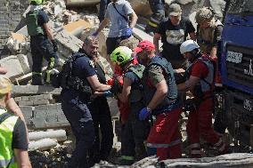 Section of Kyiv apartment block destroyed by Russian missile strike