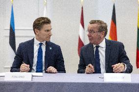 Signing of a sea mine cooperative agreement at the NATO summit