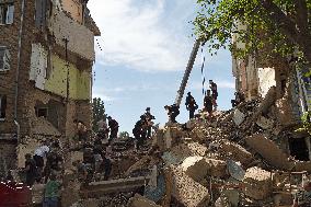 Removing rubble at Kyiv apartment block