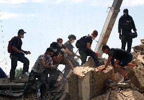 Removing rubble at Kyiv apartment block