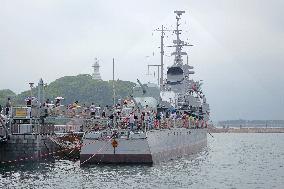 Tourists Visit A Decommissioned Warship in Qingdao