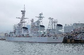 Tourists Visit A Decommissioned Warship in Qingdao