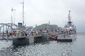 Tourists Visit A Decommissioned Warship in Qingdao