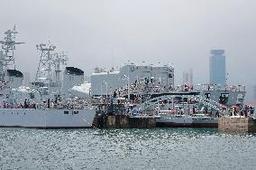 Tourists Visit A Decommissioned Warship in Qingdao